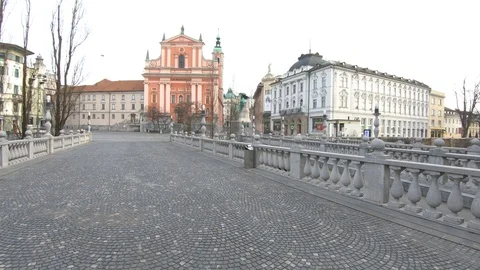 Left pan empty Triple Bridge and Preseren main square on workday Stock Footage 127742142