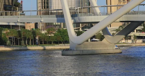Left pan motion of ferry under bridge at Brisbane CBD, QLD, 10-17-2025 Stock Footage 320172315