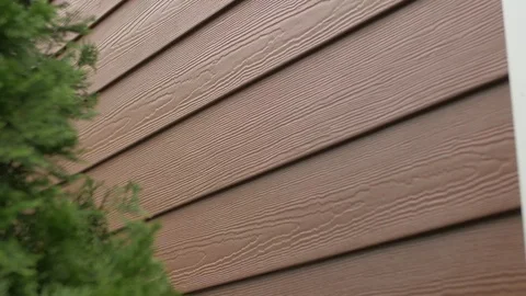 Left Pan from Red Siding to Green Foliage Видео 100898964