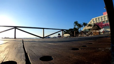 Left panning of a dock with backlighting sun at Isla Mujeres Video stock 96567668