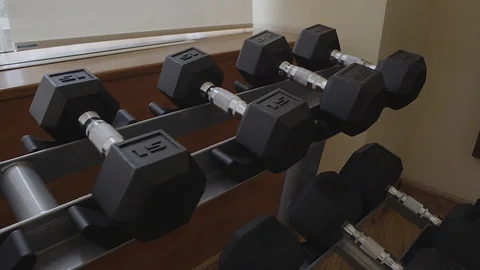 LEFT PANNING OVER WEIGHTS OF A GYM Stock Footage 107291444