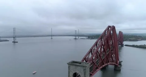 Left to Right aerial tracking shot of the Forth Rail Bridge looking Stock Footage 169062299