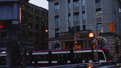 Left to right camera pan tracking urban tramway train going through Vídeos de archivo 208834384