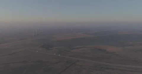 Left to Right Drone Flight Following Cars Toward Wind Farm, Russia Vídeo Stock 344035284