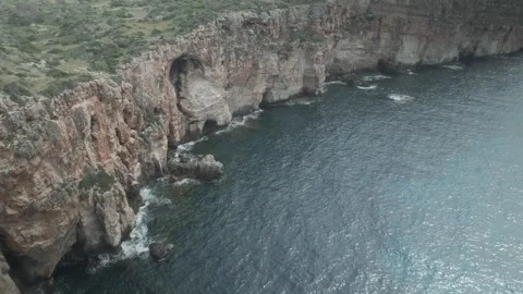 Left-to-Right Drone Flight from the Mediterranean Sea Toward Menorca Cliffs Stock-Footage 344190884