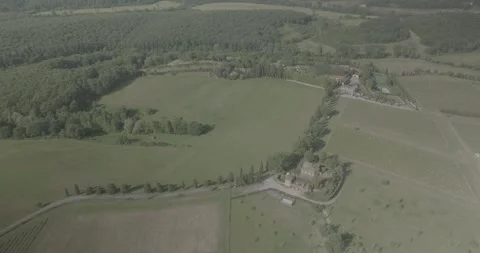 Left to Right Drone Flyby of Tuscan Villa, Country Road and Hills in Italy Stock Footage 343932200