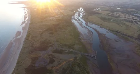 Left to Right of Drone Shot Featuring Scottish Delta at Sunset 스톡 동영상 97527011