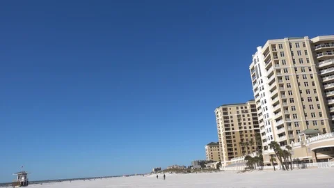 Left To Right Pan From Beach To Big Massive Hotels Resorts Beachside With Pa 動画素材 127375453