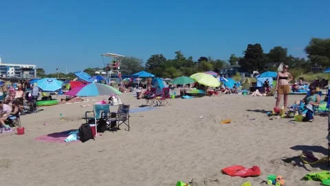 Left Right Pan Of Beach Goers On Sandy Beach In Summer 스톡 동영상 249955431