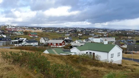 Left to right pan cityscape of a small town near the sea Stock Footage 92640320