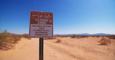 Left To Right Pan Closed Area Sign In California Desert Stock Footage 149706263