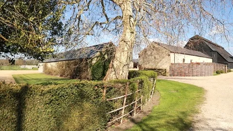 A Left To Right Pan Of A Cottage Barn Conversion Video stock 120770143