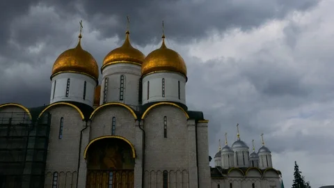Left to right pan Dormition Cathedral to Ivan the Great Bell Tower cloudy sky Stock Footage 99257684