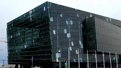 Left to right pan in exterior view of Harpa concert hall and conference centre Stock Footage 93219248