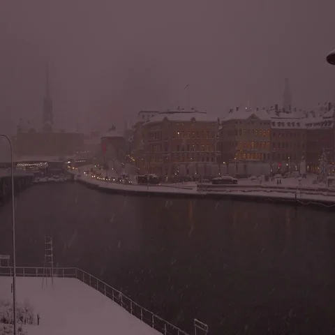 Left to right pan on gamla stan the Stockholm old town under heavy snow and fog Stock Footage 69555280