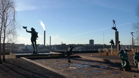 Left to right pan in a garden full of tall statues Stock Footage 75044455