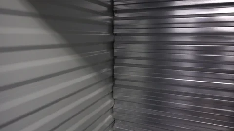 Left To Right Pan Of Inside Of Metal Self Storage Unit Stock Footage 121648000