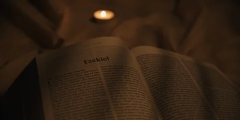Left to right pan over bible Stock Footage 126076864