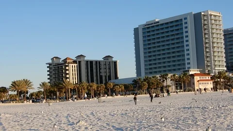 Left To Right Pan With People On Beach Vacation Beach Resort At Sunset Stock Footage 127250096