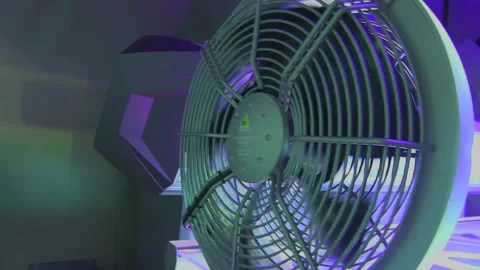 Left to right pan of a pink and blue lit tanning bed Vidéo 142186683