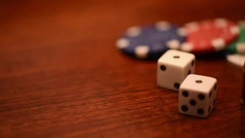 Left to right pan quick dice bullets hundred dollar bills Stock Footage 75763552