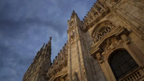 Left to right pan real time medium shot of a Milan Cathedral. A popular tourist Stock Footage 122288702