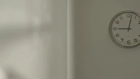 Left to right pan revealing wall clock Stock Footage 334050061
