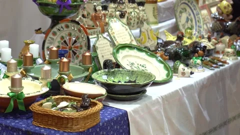 A left-to-right pan shot in a thrift store displaying handcrafted porcelain Stock Footage 301678392