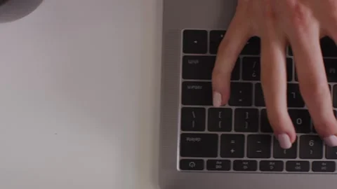 Left to right pan shot of a woman's hands typing on the keyboard Stock-Footage 264270759