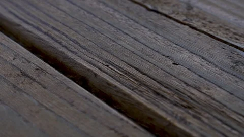 Left to right pan of stained deck boards close up. Stock Footage 108895315