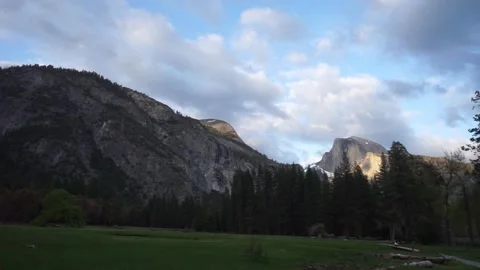 Left to right pan: Upper Yosemite Falls and Half Dome from the valley Stock Footage 241194132