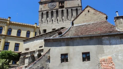 Left-Right Pan view in front of the Sighisoara Clock Tower. HD Video Stock Footage 98951864
