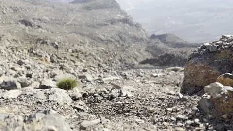 Left to right shot of falling stone in mountains Stock Footage 227137165