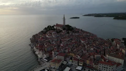 Left-to-Right Sunset Orbit of Rovinj Church in 4K Stock Footage 258369420