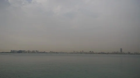 Left to right view Old wooden boats (dhows)  in Doha Harbor - Doha, Qatar Stock Footage 107729644