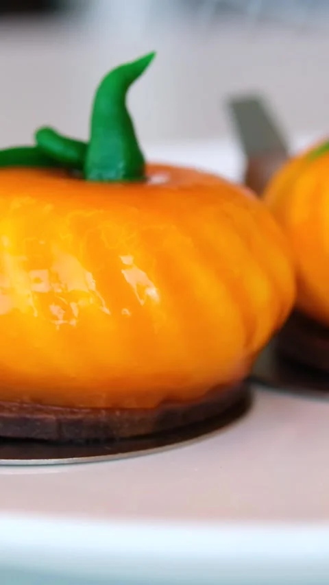 Left to right zenithal pan showing Halloween shaped cookies, cups and plates Stock Footage 317781679