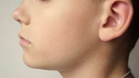 The left side of the child's face. The ear is close-up. Stock Footage 89932641
