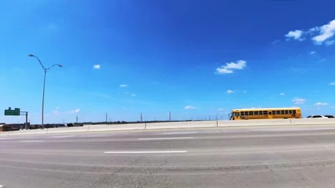 Left side drive plate on freeway, motorcycle cops escort limo and hearse Vídeo Stock 252331537