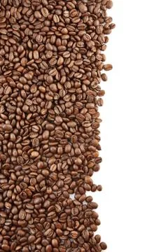Left side frame of scattered coffee beans on white background Stock Photos