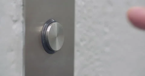 Left side macro view of finger pressing elevator button 4K Stock Footage 55574772