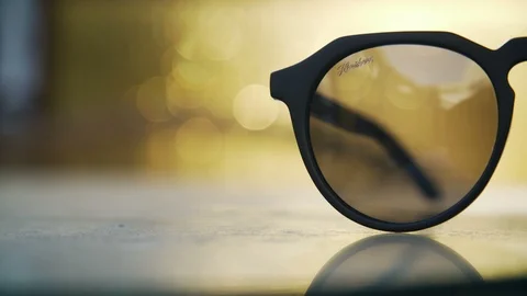 Left side of sun glasses in sunset light Stock Footage 102728579