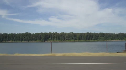 Left Side view of a Driving Plate: Car travels east on NE Marine Drive in Stock Footage 59314618