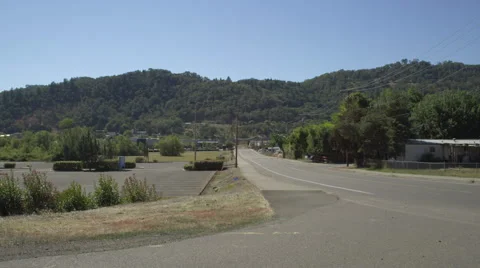 Left Side view of a Driving Plate: Car travels through a low-income residential Stock Footage 59328232