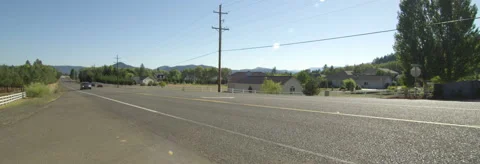 Left Side view of a Driving Plate: Car turns left from Garden Valley Road onto Stock Footage 59328740