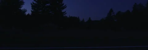 Left Side view of a Driving Plate: Car travels at dusk along Melqua Road between Stock Footage 59330738