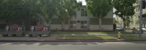 Left Side view of a Driving Plate: Car travels through residential area on Stock Footage 59383832