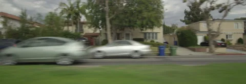 Left Side view of a Driving Plate. Car travels south through residential area on Stock Footage 59419521