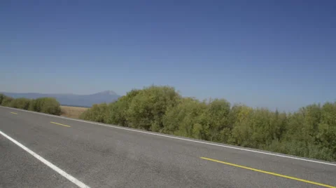 Left Side view of a Driving Plate: Car turns left onto Silver Lake Road (County Stock Footage 59511609