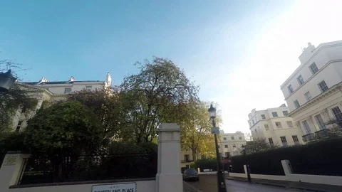 Left Side View Of A Driving Plate Car Travels By Outer Circle London rich area Stock Footage 69760431