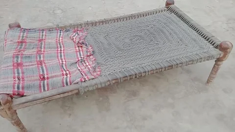 Left Side View of a Traditional Pakistani Charpai in Daylight Stock Footage 347182682